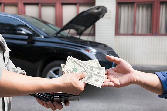 Cash being handed over for a junk car